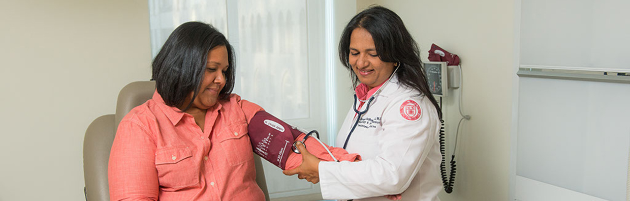 Weill Cornell Medicine doctor measuring a patient's blood pressure