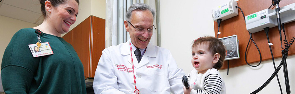 Weill Cornell Medicine providers interact with a young patient.