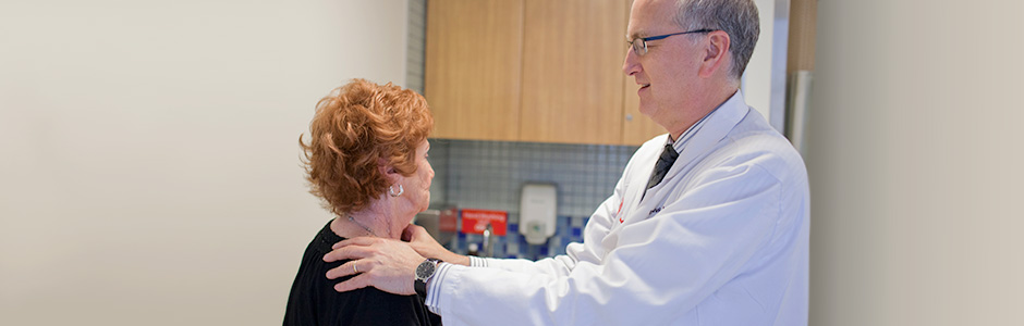 Dr. David Nanus interacting with patient