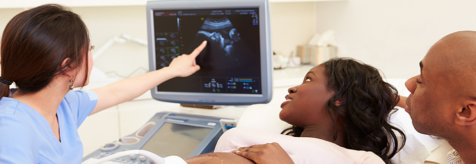 A woman receiving an obstetric ultrasound.