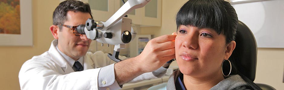 A patient receives an ear examination.