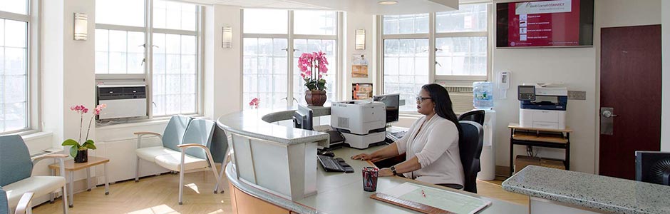 A patient coordinator at the front desk.