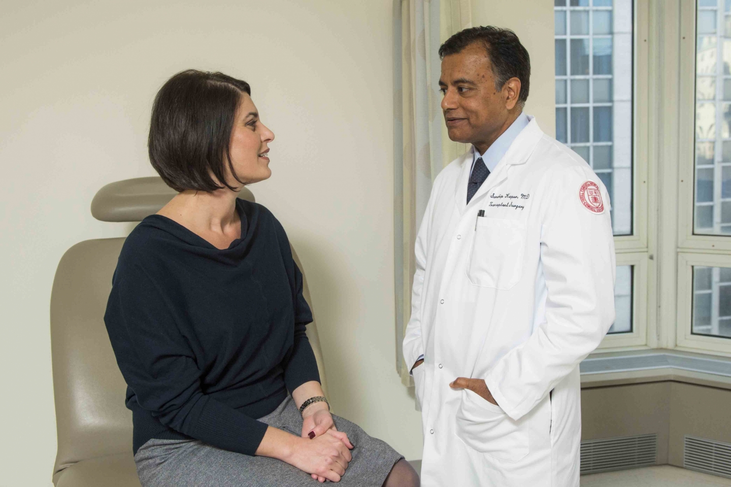 Dr. Sandip Kapur interacts with a patient.