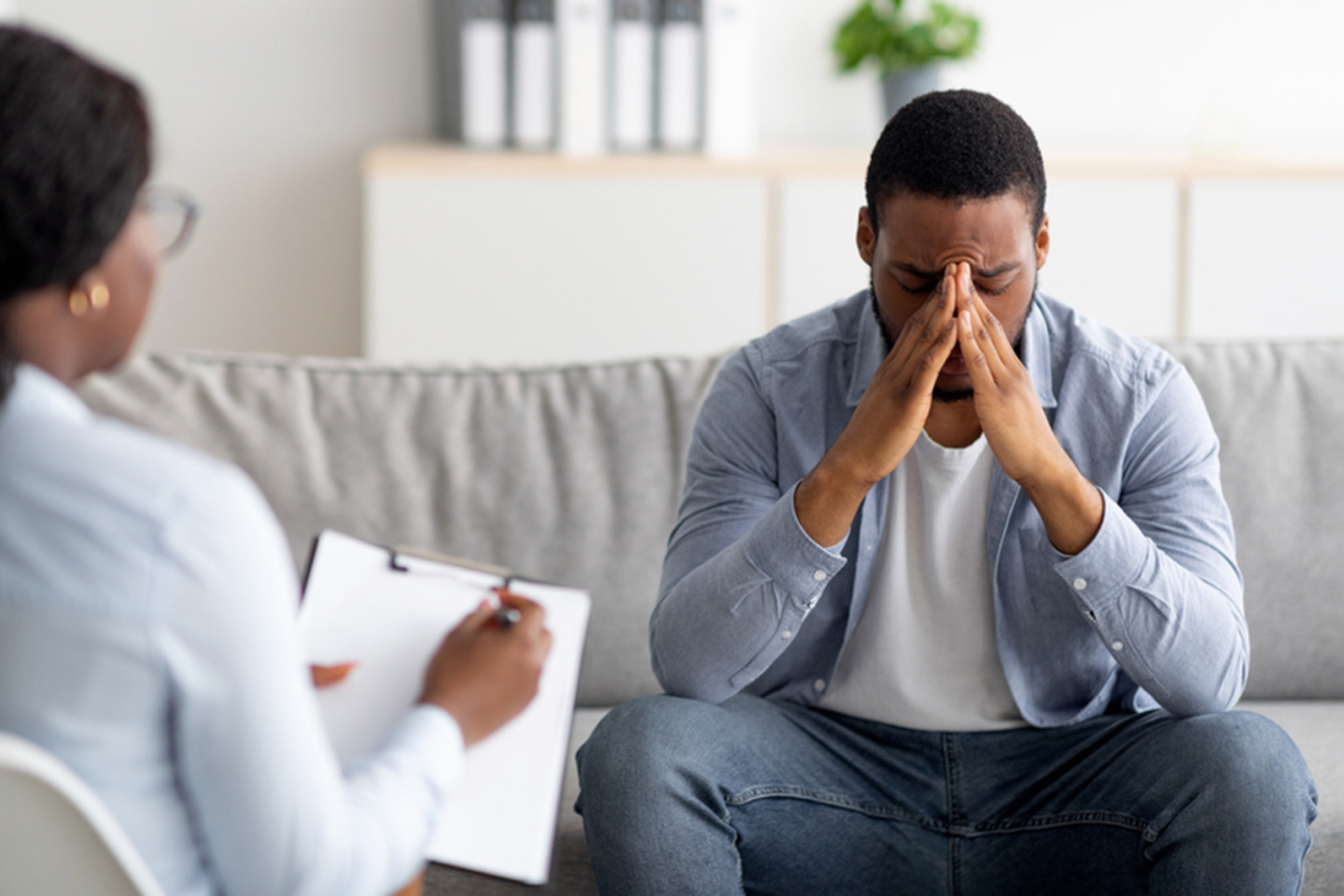 Doctor taking notes with Patient