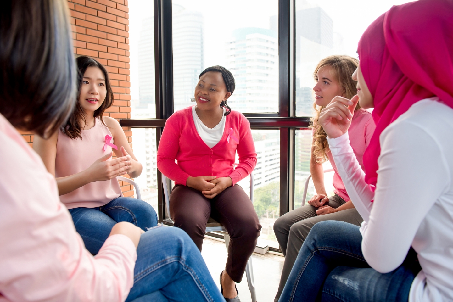 Stock photo of breast cancer patients in a group discussion