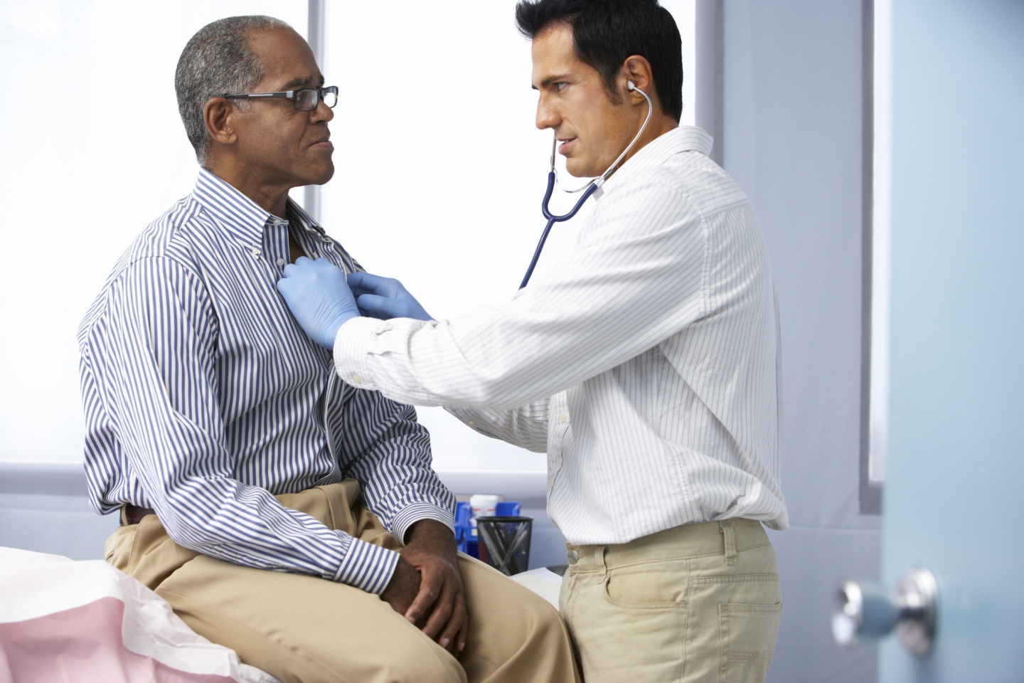 Doctor listens to a patient's chest using a stethoscope