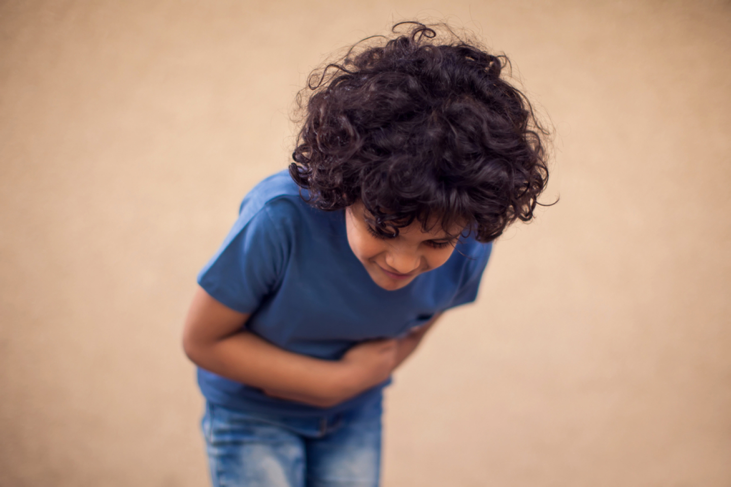 kid holding his stomach