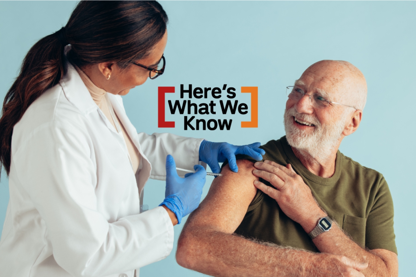 doctor administering vaccine to older man