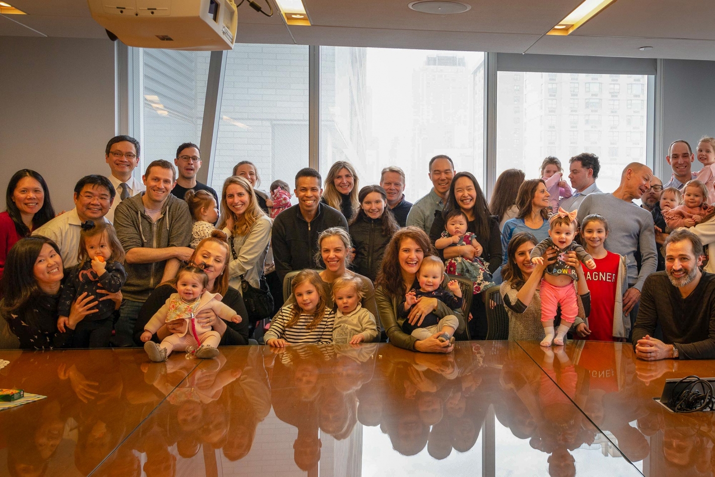 Parents surprised Dr. Pak H. Chung to thank him for helping them start their families. Weill Cornell Medicine's Dr. Pak Chung poses with the families he has helped.