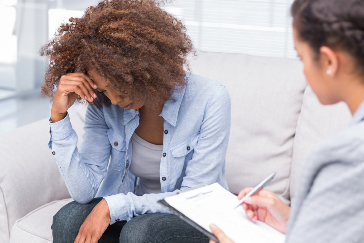 doctor taking notes with Patient
