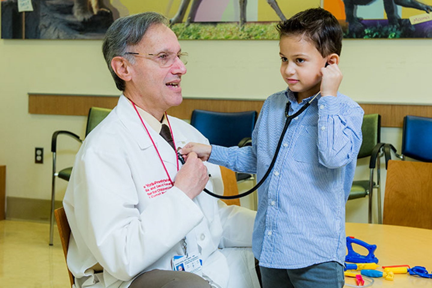 A child plays with a doctor's stethoscope 