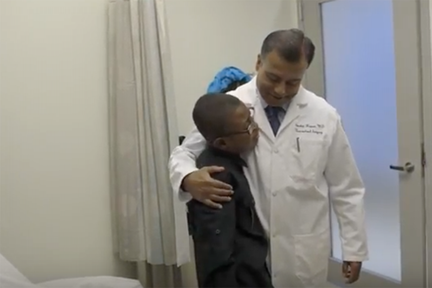 Doctor comforts a Evan Hubbard