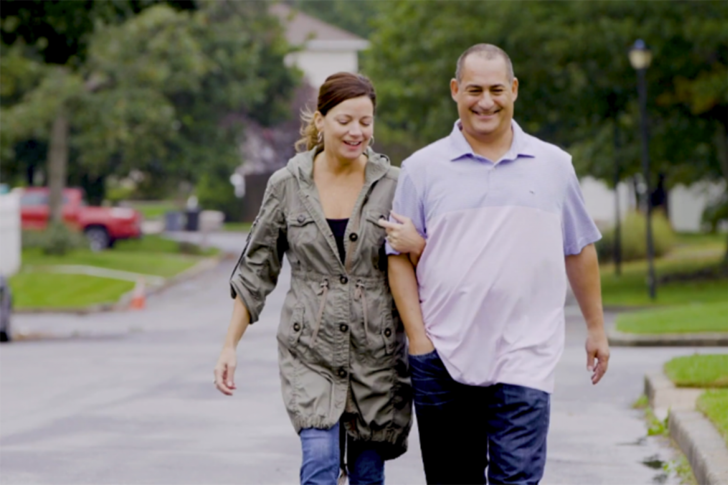 Sandy Krykostas walking with his wife.