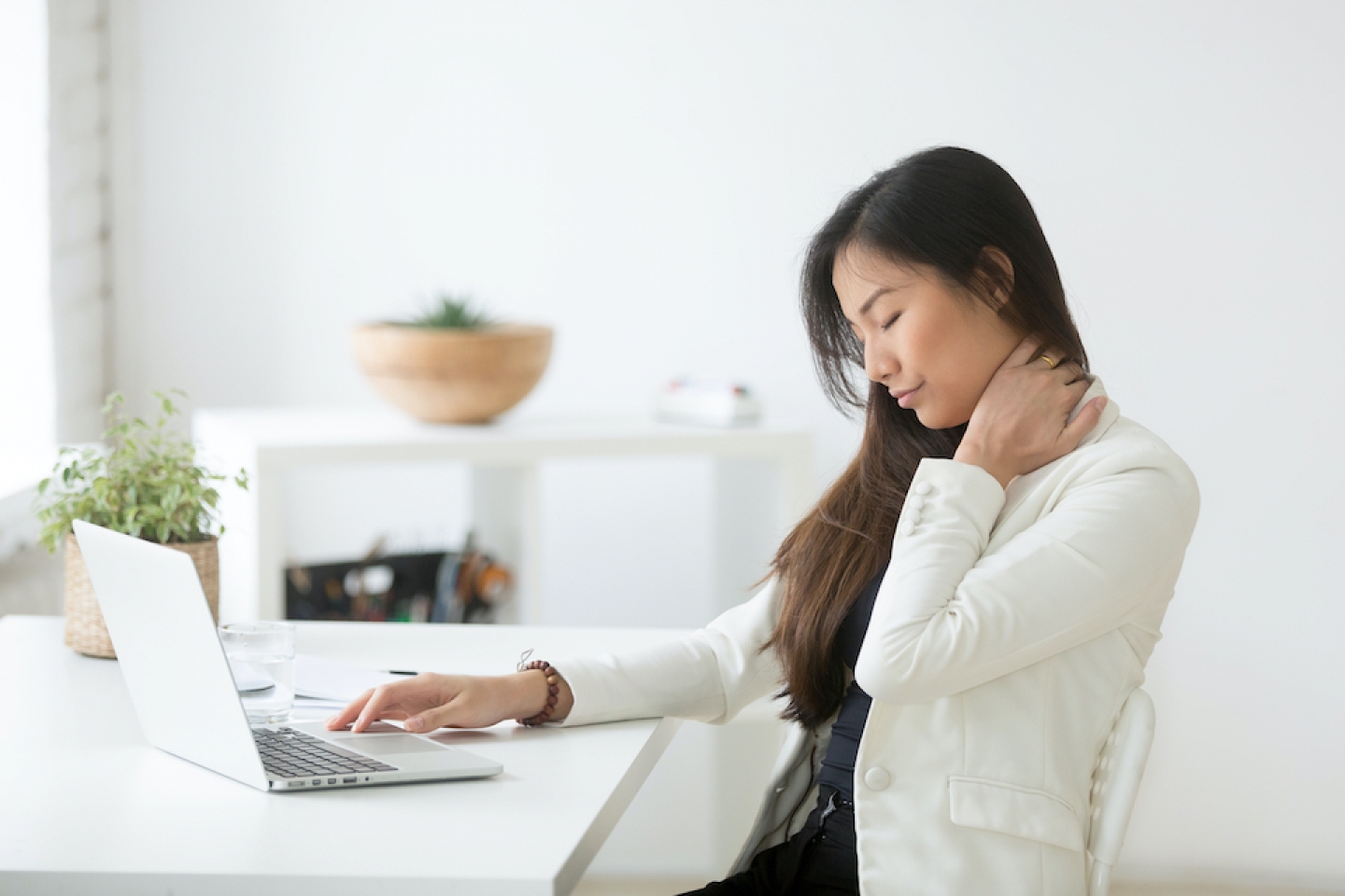 woman working on computer with strain