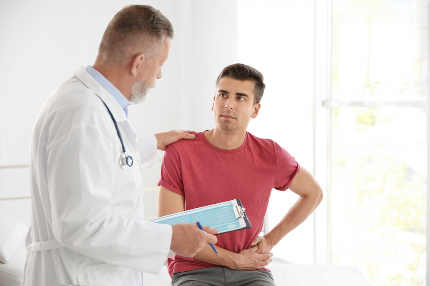 male patient meets with doctor