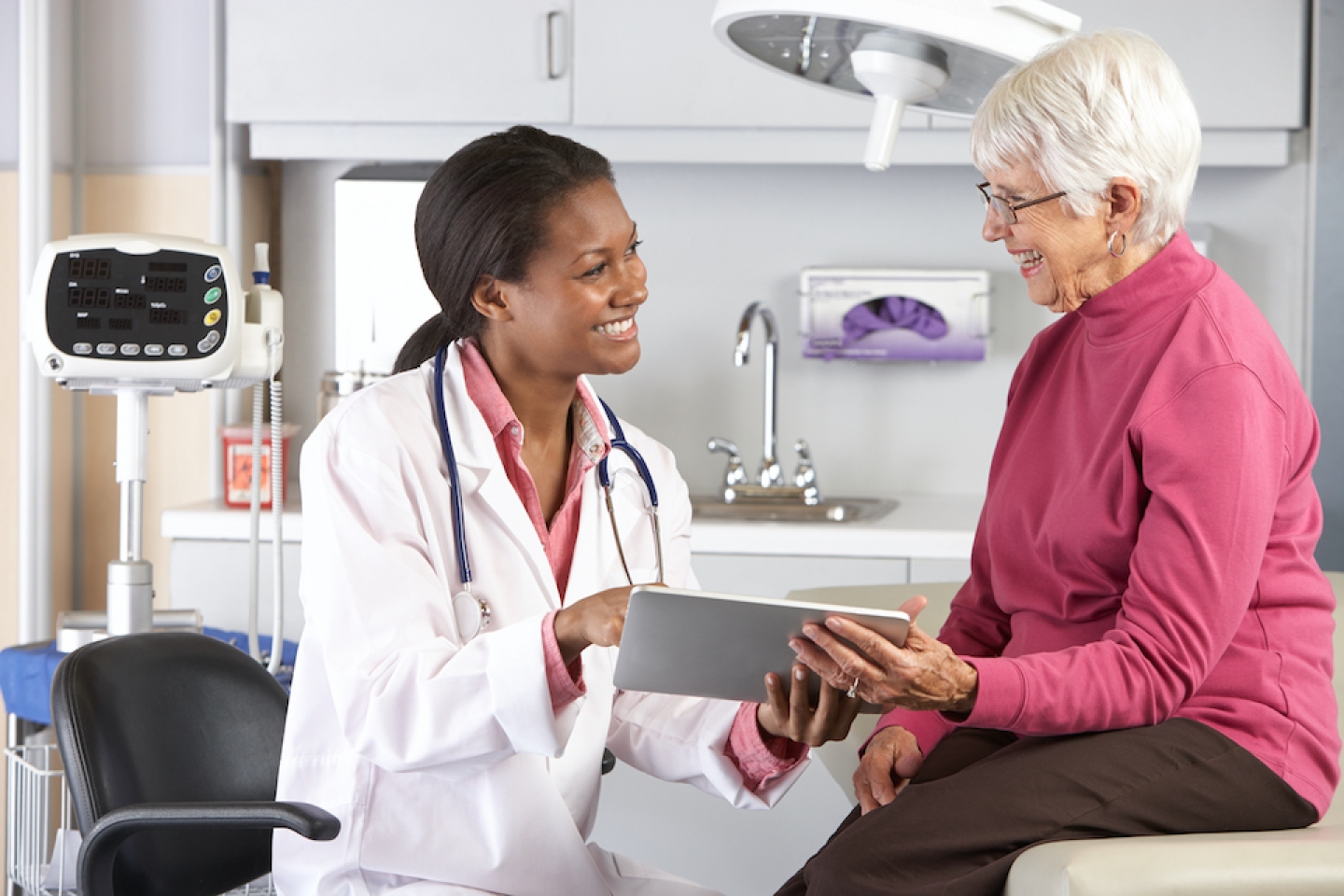 doctor interacting with older patient