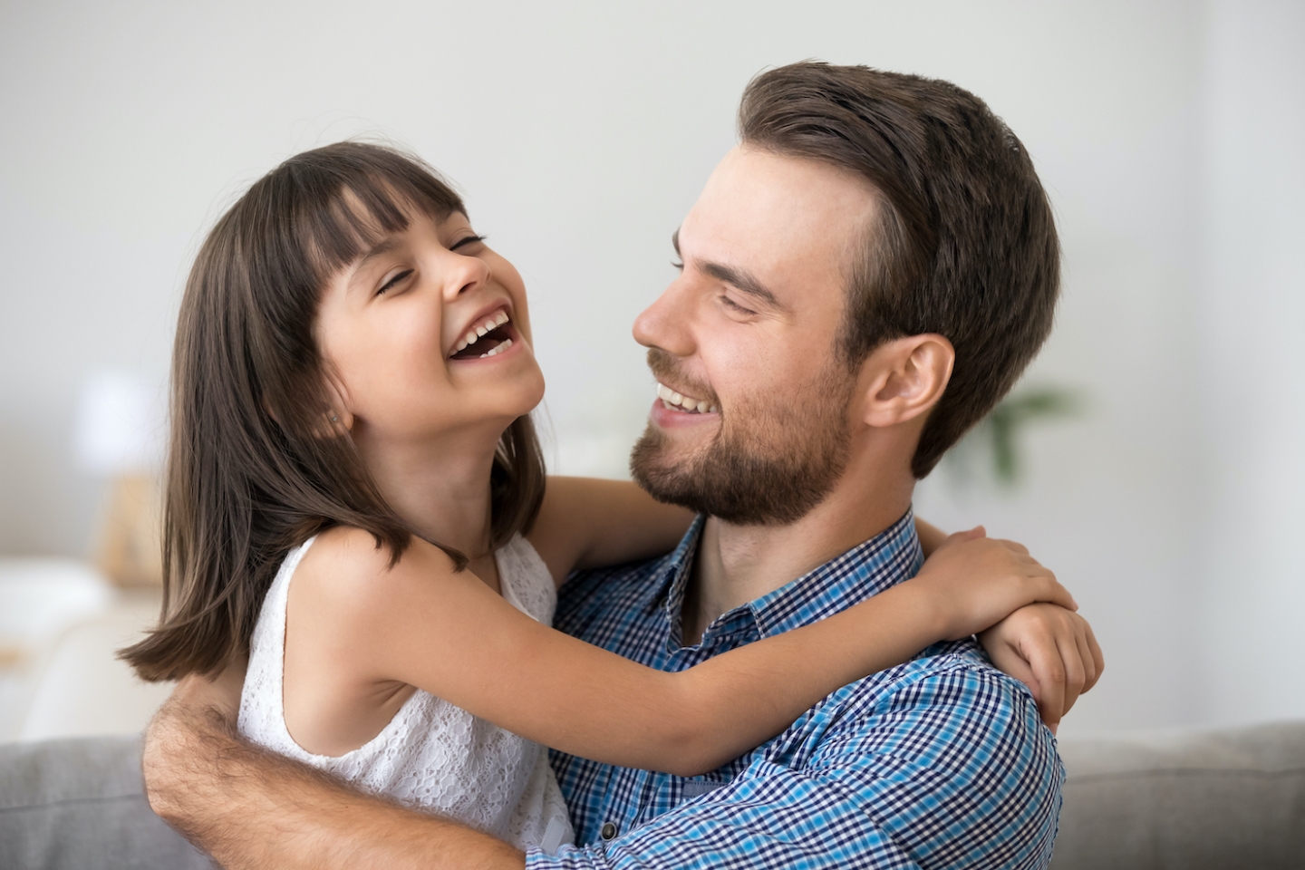 dad and daughter laughing