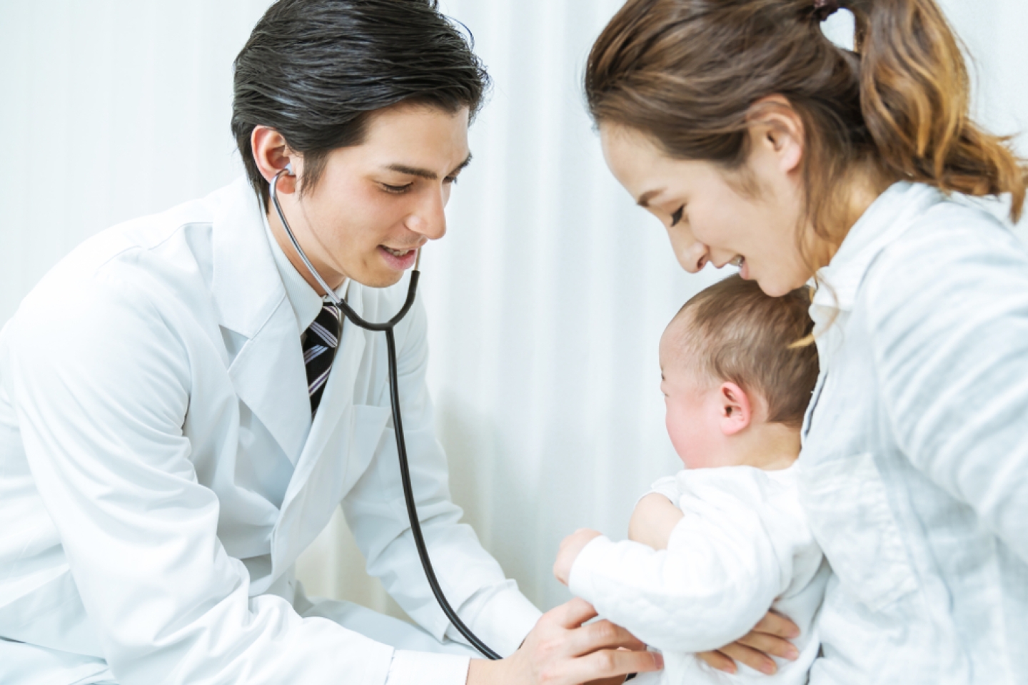 Doctor and mother and child in a consultation room. Pediatrician.