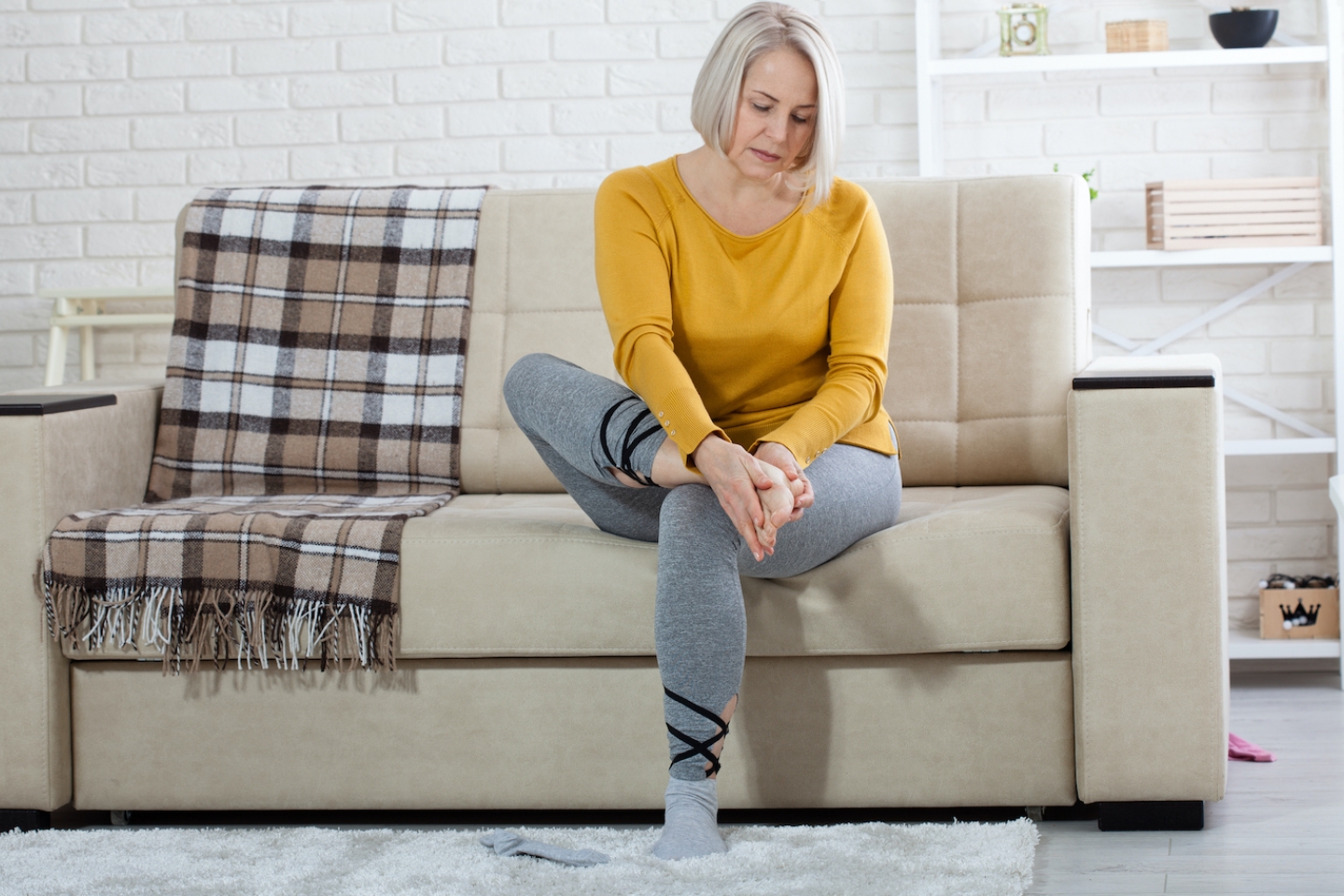 woman checks feet