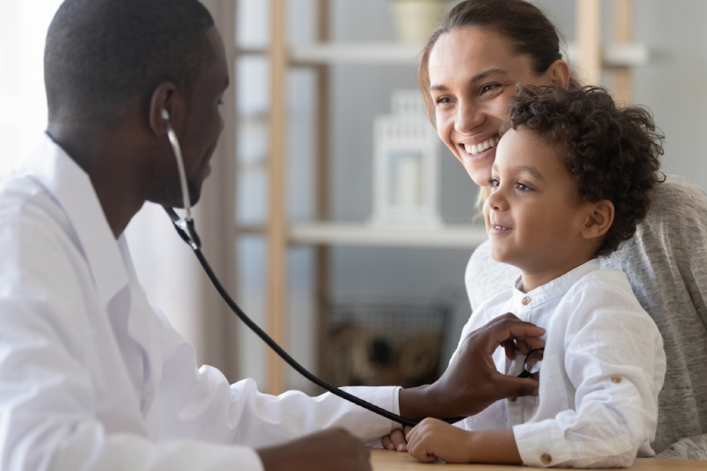 doctor checks child's heart