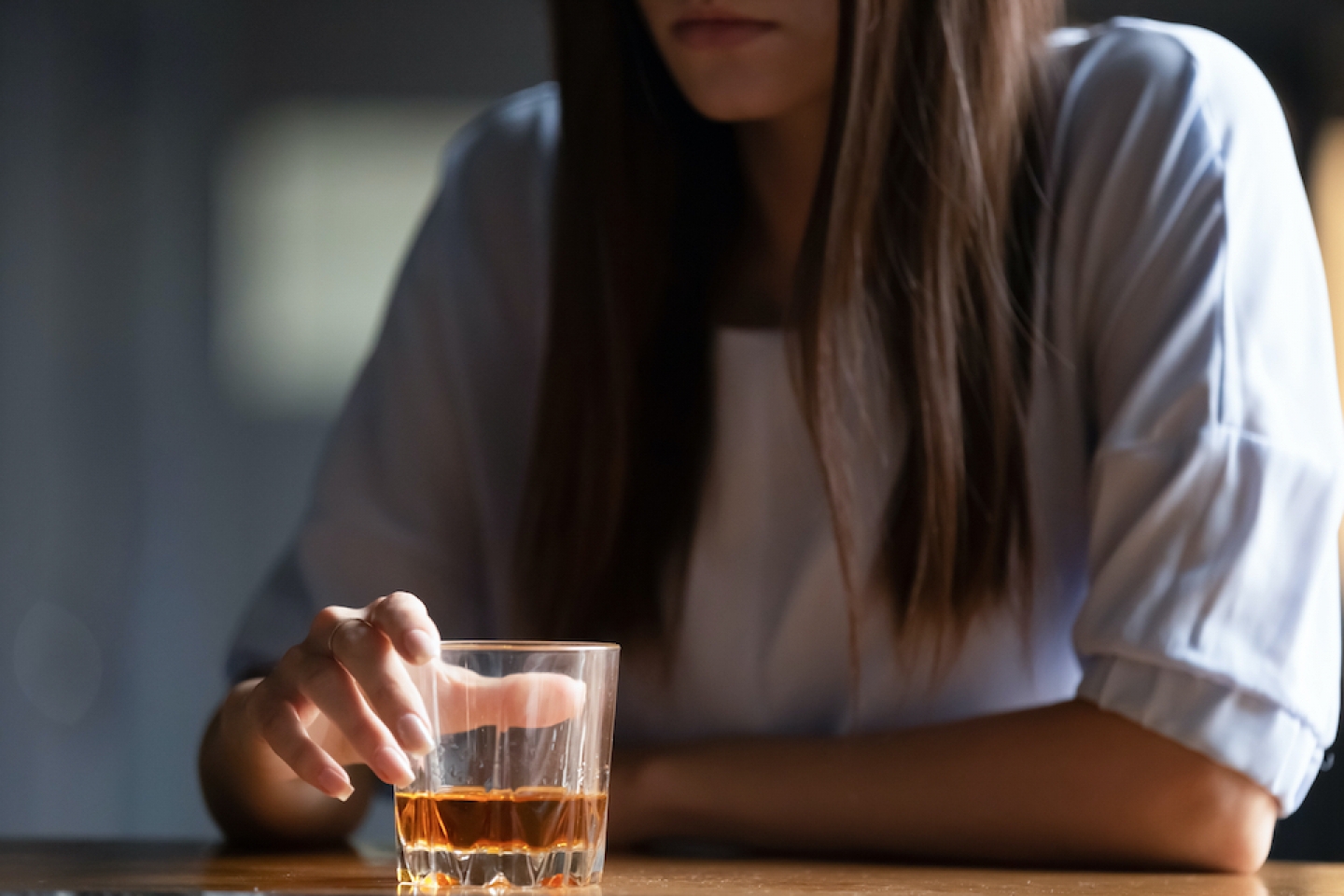 woman with an alcoholic drink