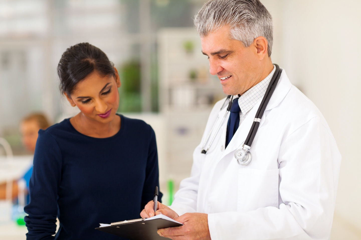 patient and doctor reviewing charts