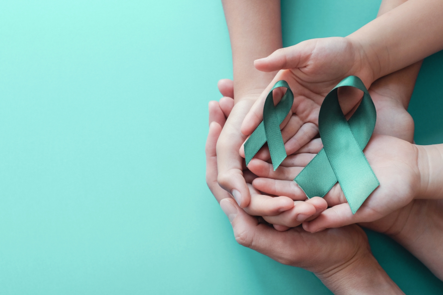 Teal ribbons on blue background, Ovarian Cancer, cervical Cancer, PCOS,