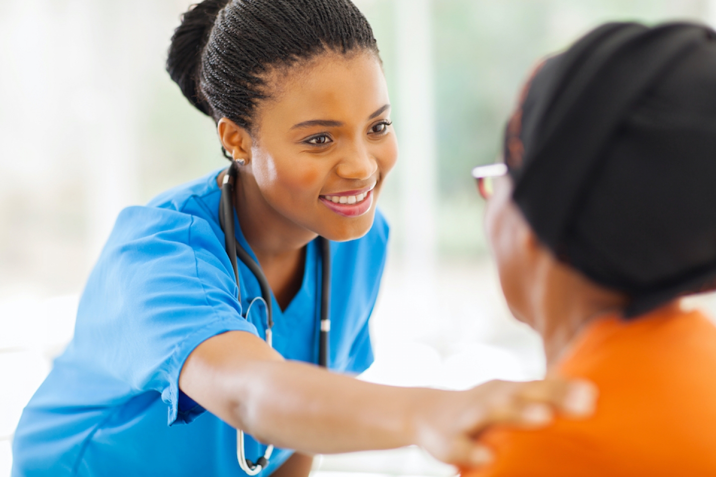 black doctor with older patient