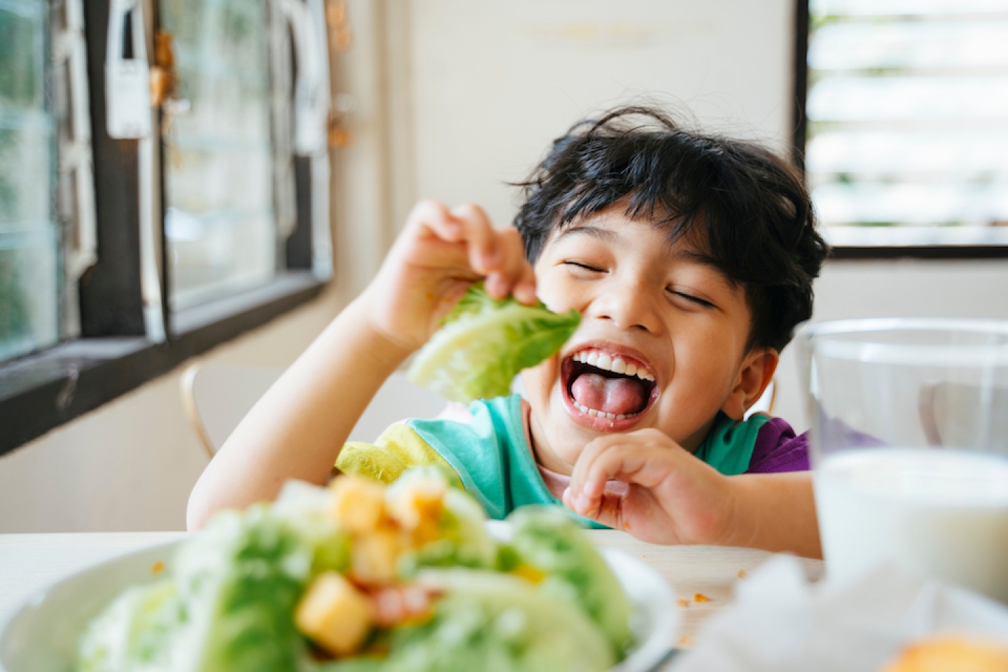 boy eating salad