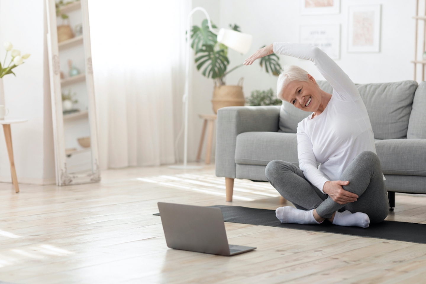 woman stretching at home