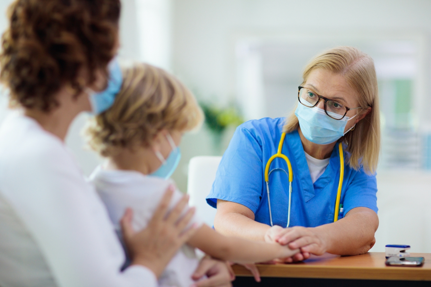 parent and child visiting doctor