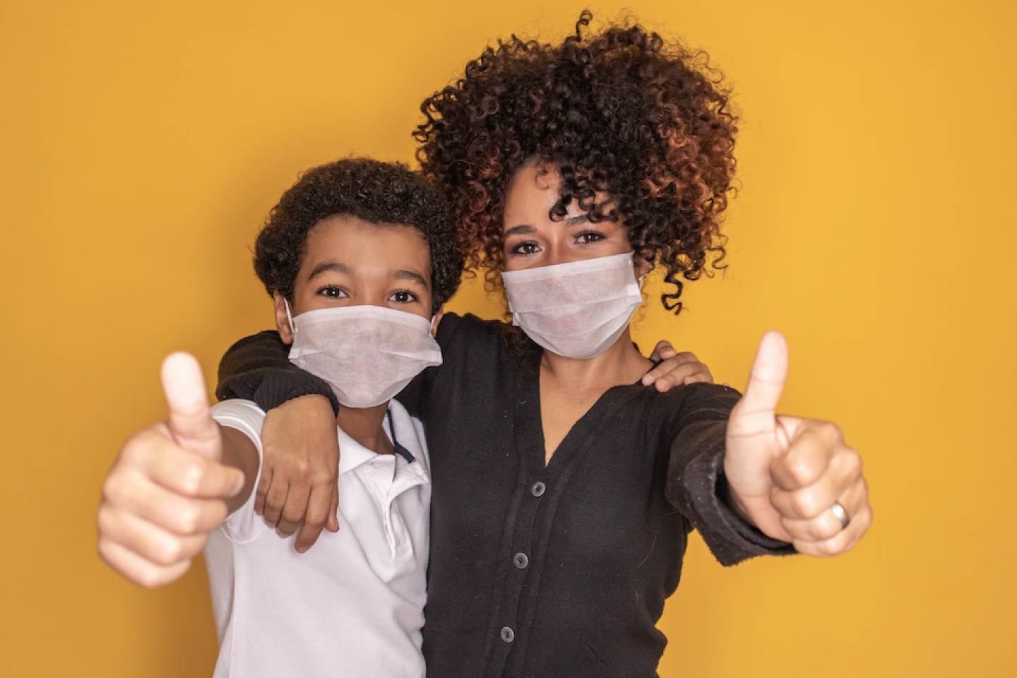 mom and son giving thumbs up