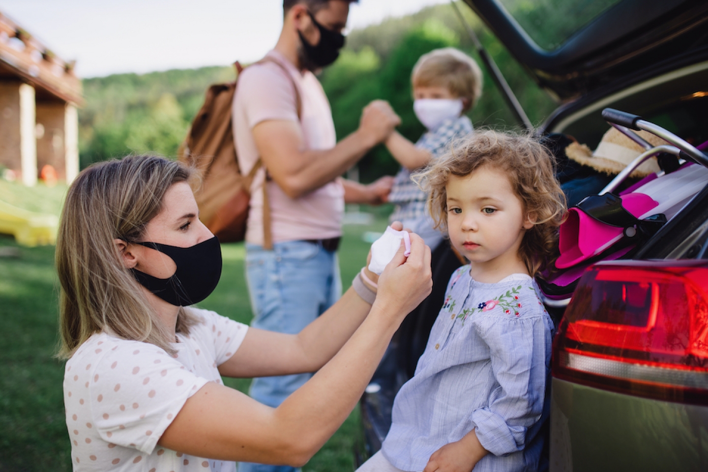 family wears masks