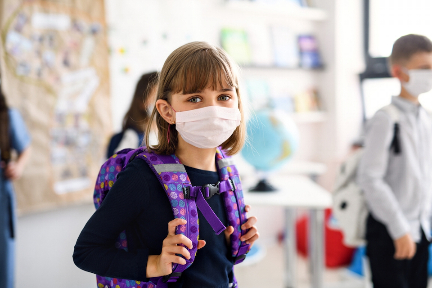 child with mask on at school