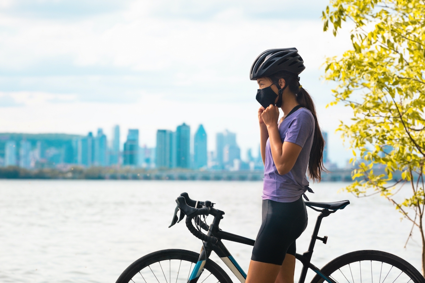 woman wearing mask while on bike