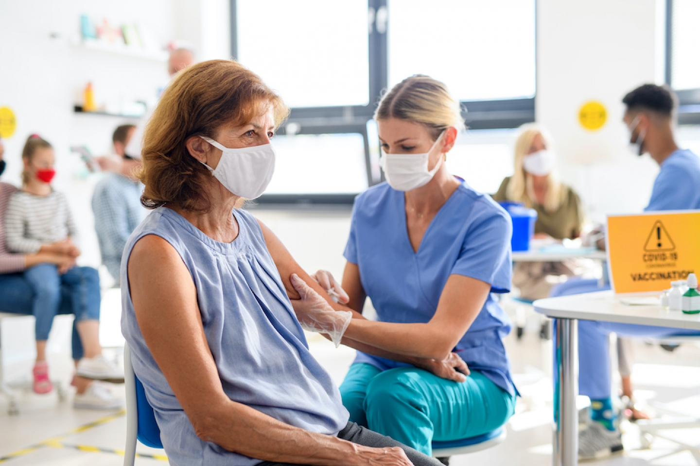 patient receiving covid-19 vaccine