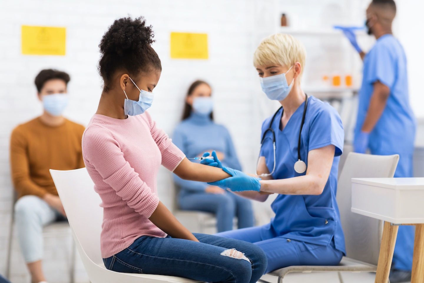 teenage girl getting her vaccine