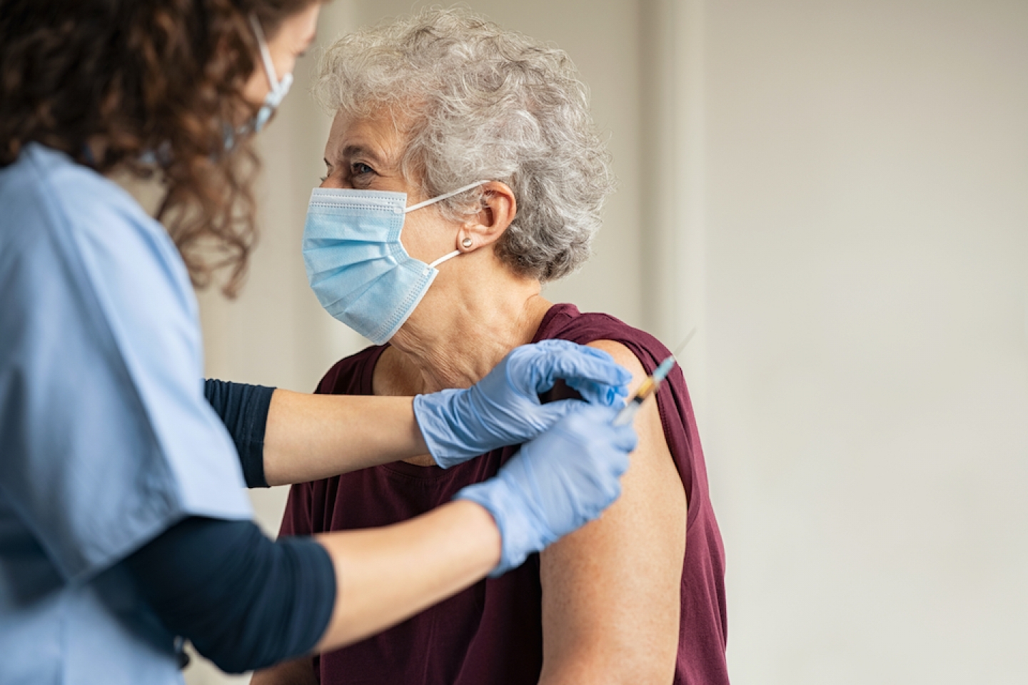 older female patient gets vaccinated