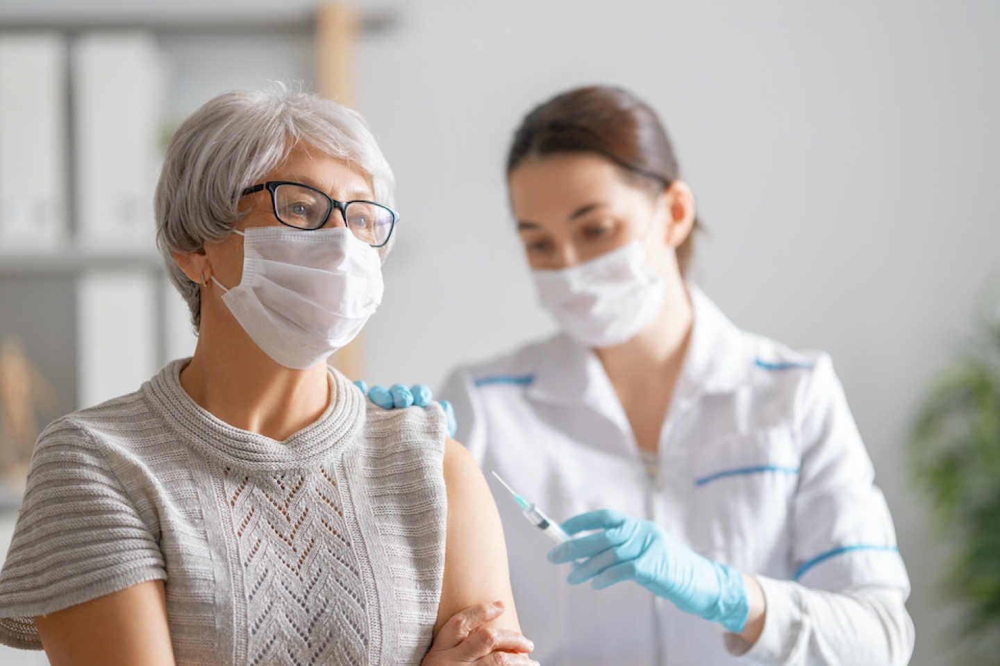 older patient receiving COVID-19 vaccine shot