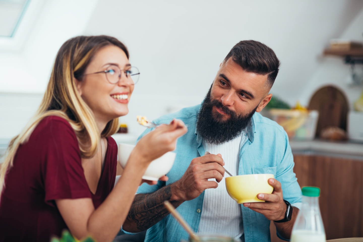 Shot of a young couple enjoying breakfast in the kitchen