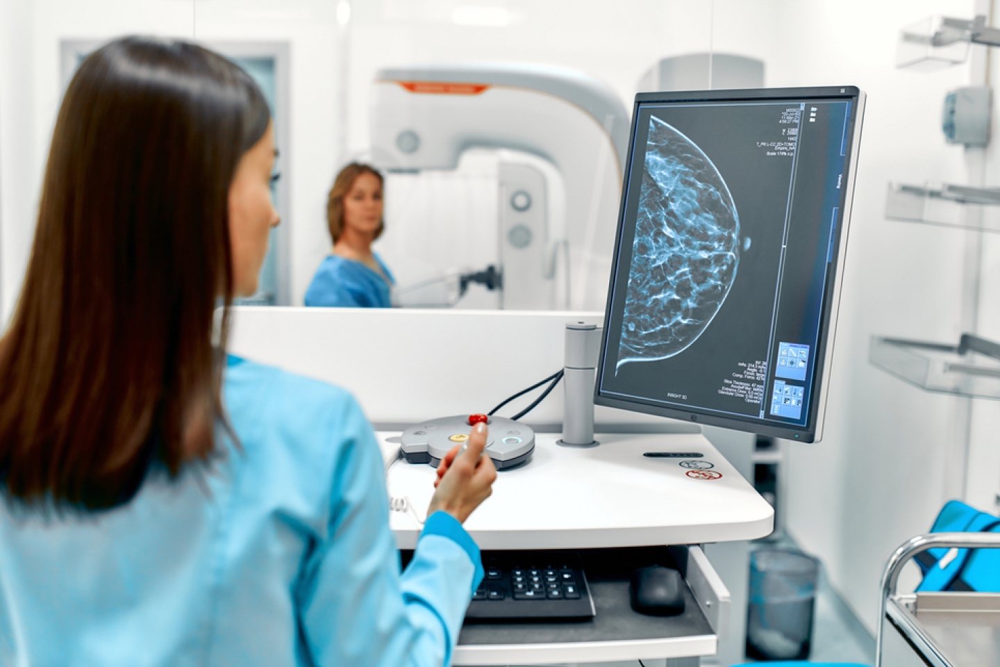 In the hospital, the patient undergoes a screening procedure for a mammogram, which is performed by a mammogram. A modern technologically advanced clinic with professional doctors.
