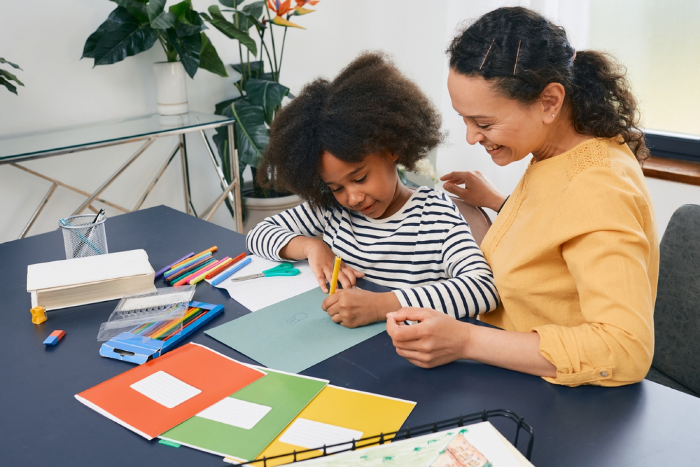 African American girl with autistic disorder with child's psychologist while psychological treatments for kid