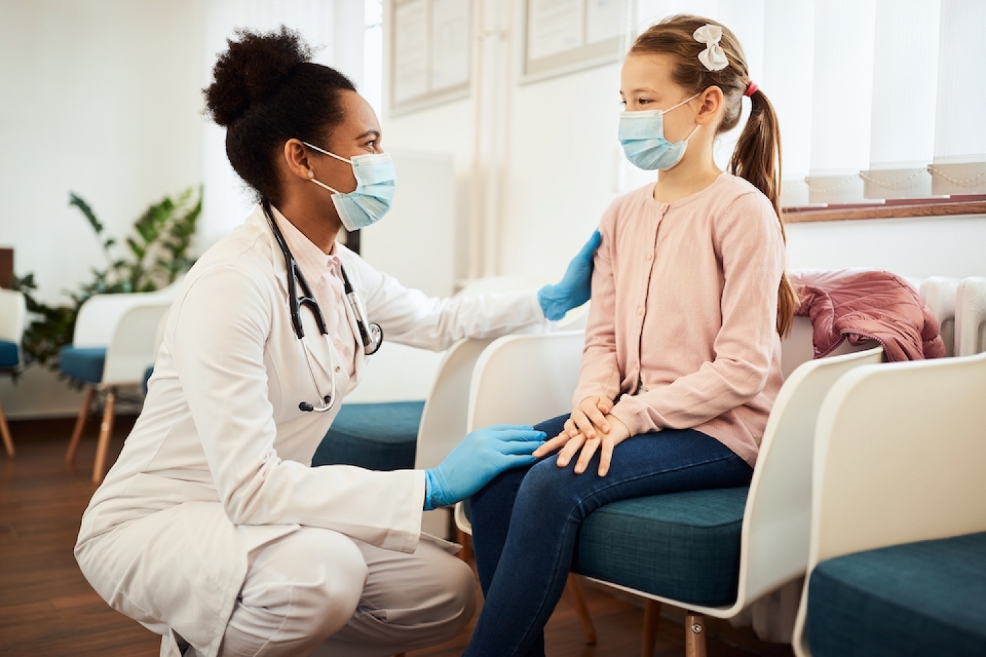 doctor meets with younger patient