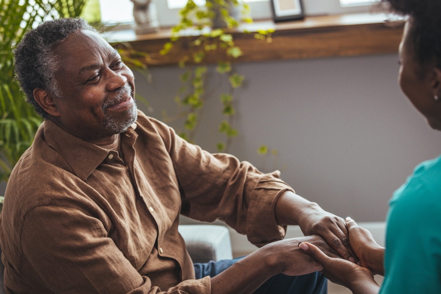 Doctor helping old patient with Alzheimer's disease