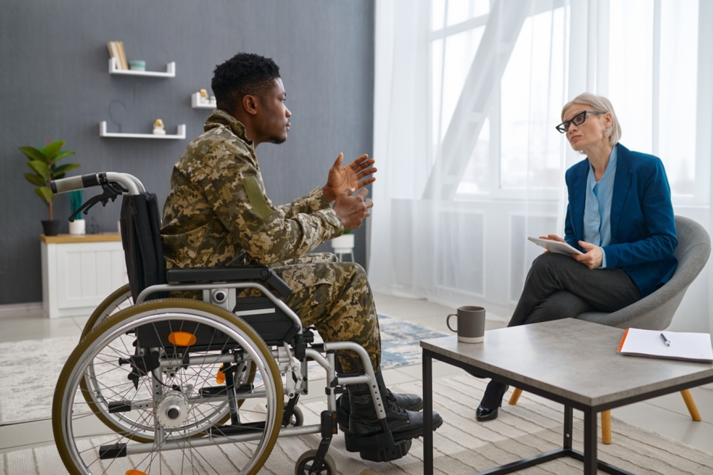 oldier in wheelchair visiting psychologist