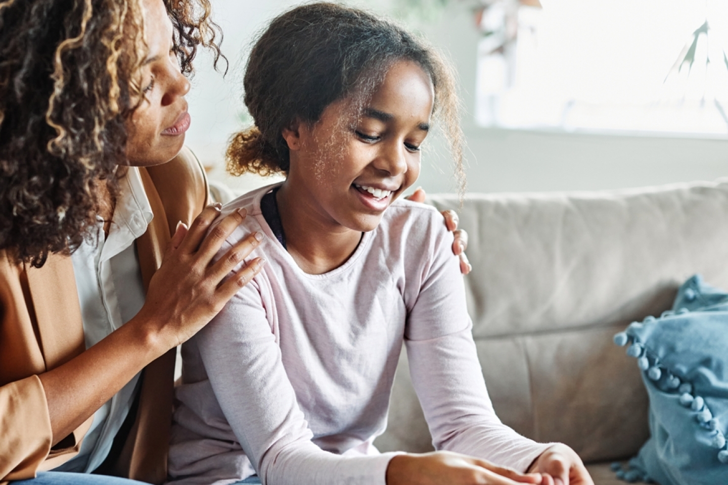 Mother with her teenage daughter at meeting with social worker, psychologist discussing mental health family sitting on sofa in psychotherapist office