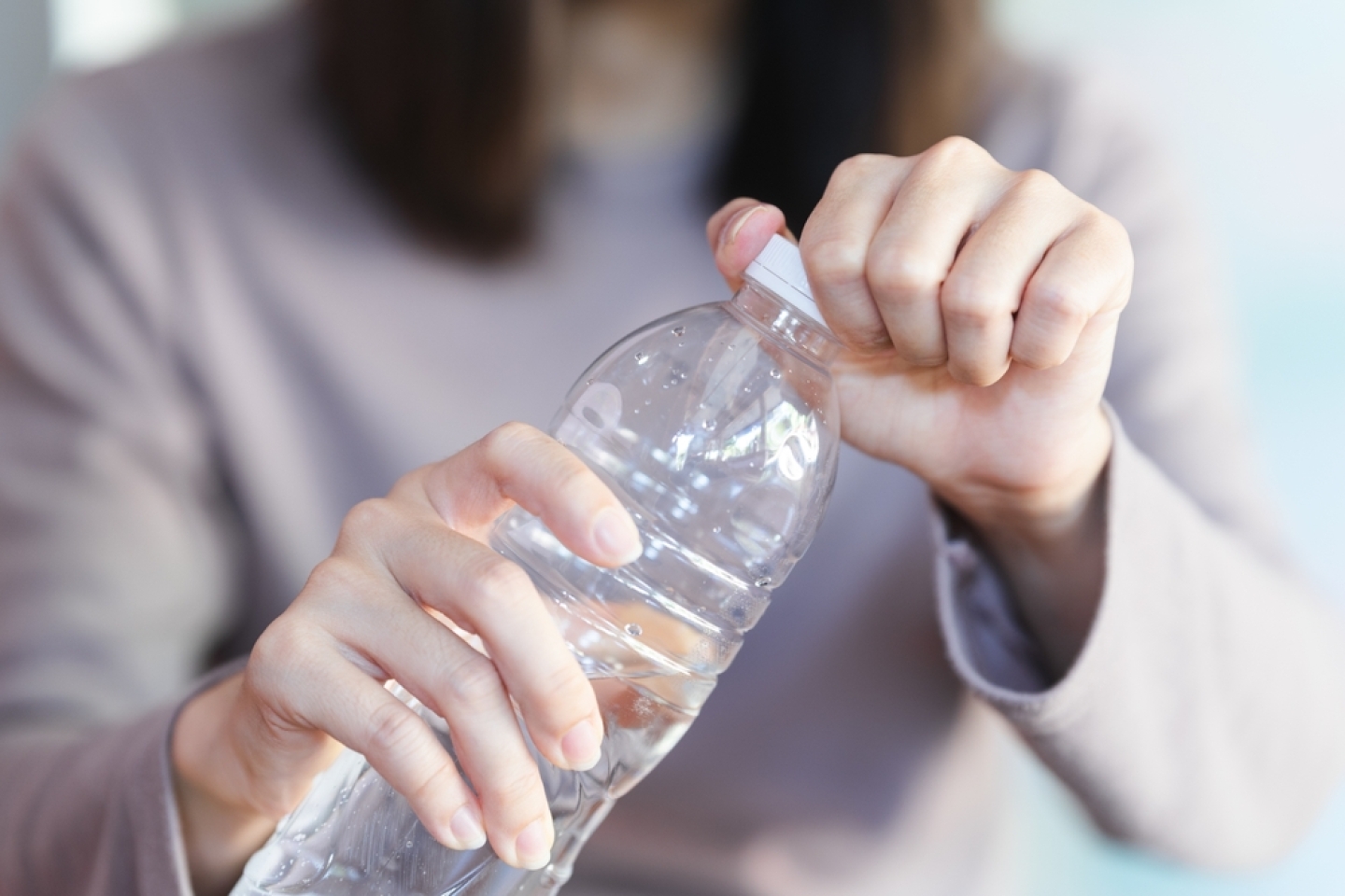 woman holding bottle