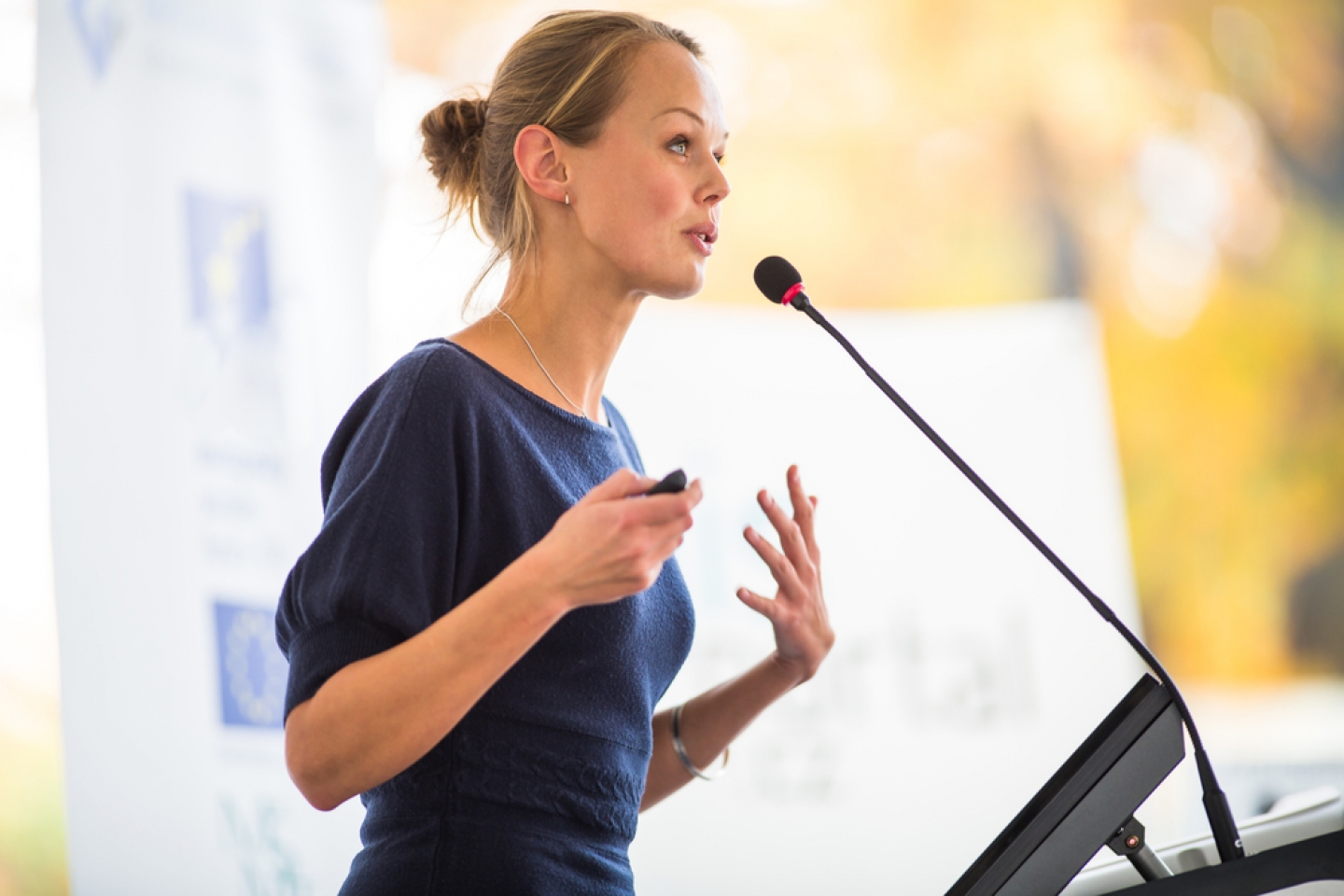 woman speaking in front of mic