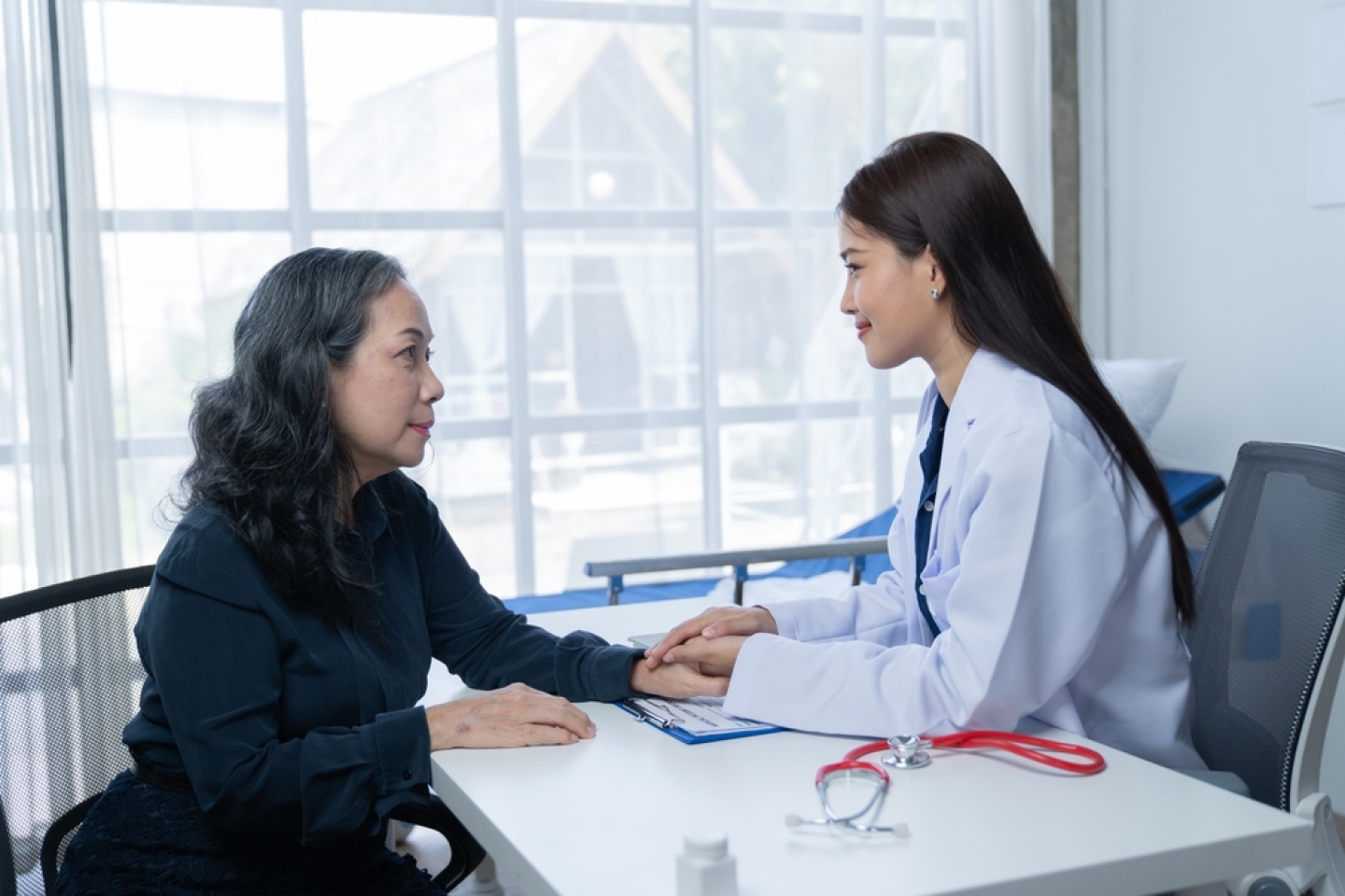 During a consultation in the office, female patients received advice on options and engaged in discussions about their overall health and treatment plans. This interaction between medical professional
