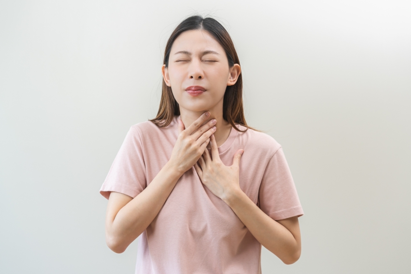 Acid reflux disease, suffer asian young woman have symptom gastroesophageal, esophageal, stomach ache and heartburn pain hand on chest from digestion problem after eat food, Healthcare medical concept